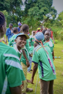 Children are smiling and playing outdoors together.