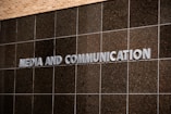 The sign says "media and communication."