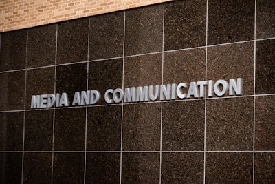 The sign says "media and communication."