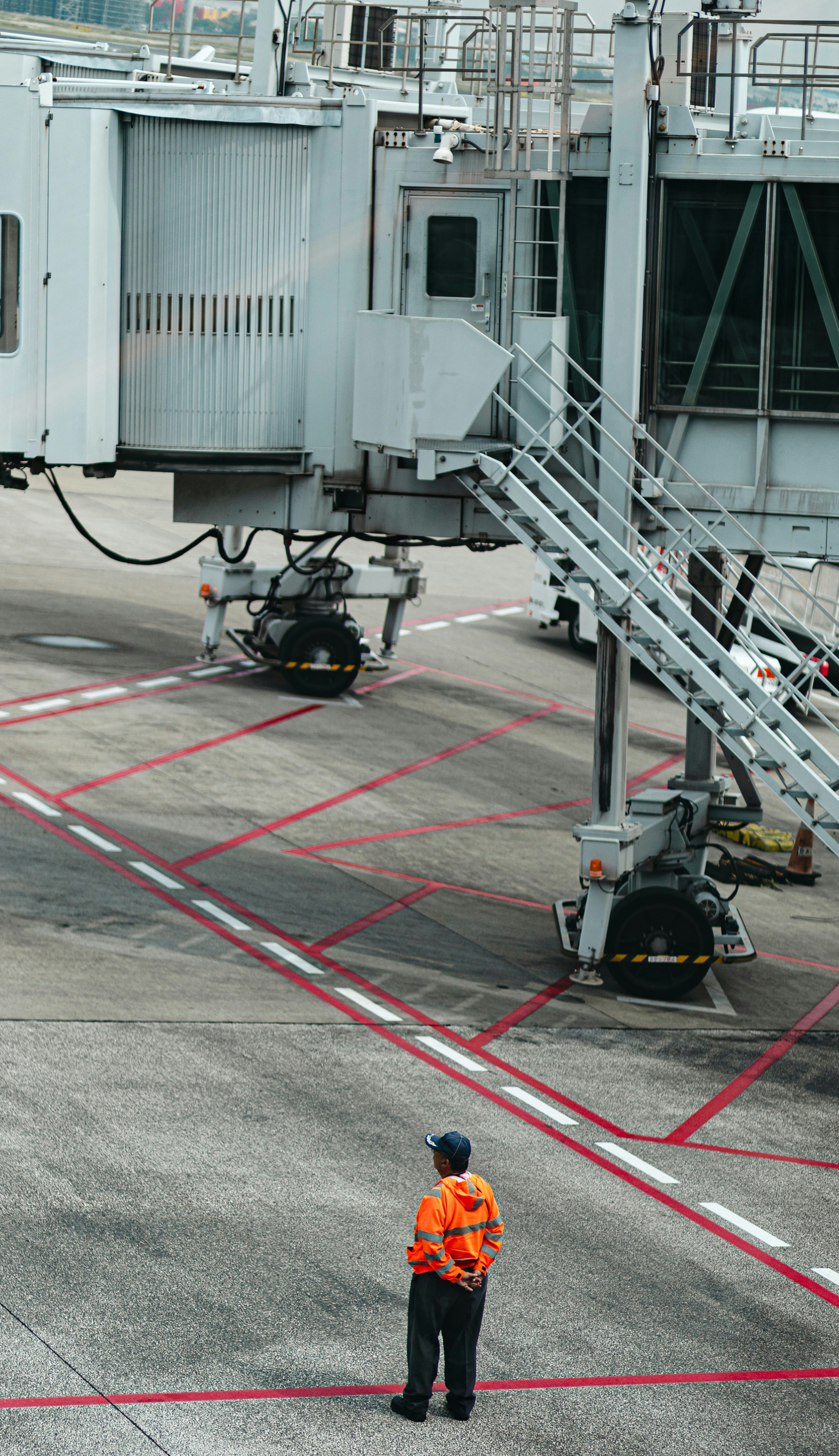A worker stands at the airport terminal.