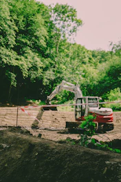 An excavator works at a construction site.