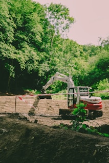 An excavator works at a construction site.