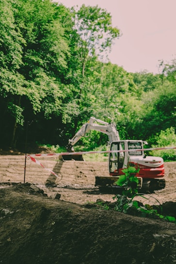An excavator works at a construction site.