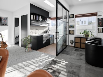 Stylish, modern kitchen with glass doors and decor.