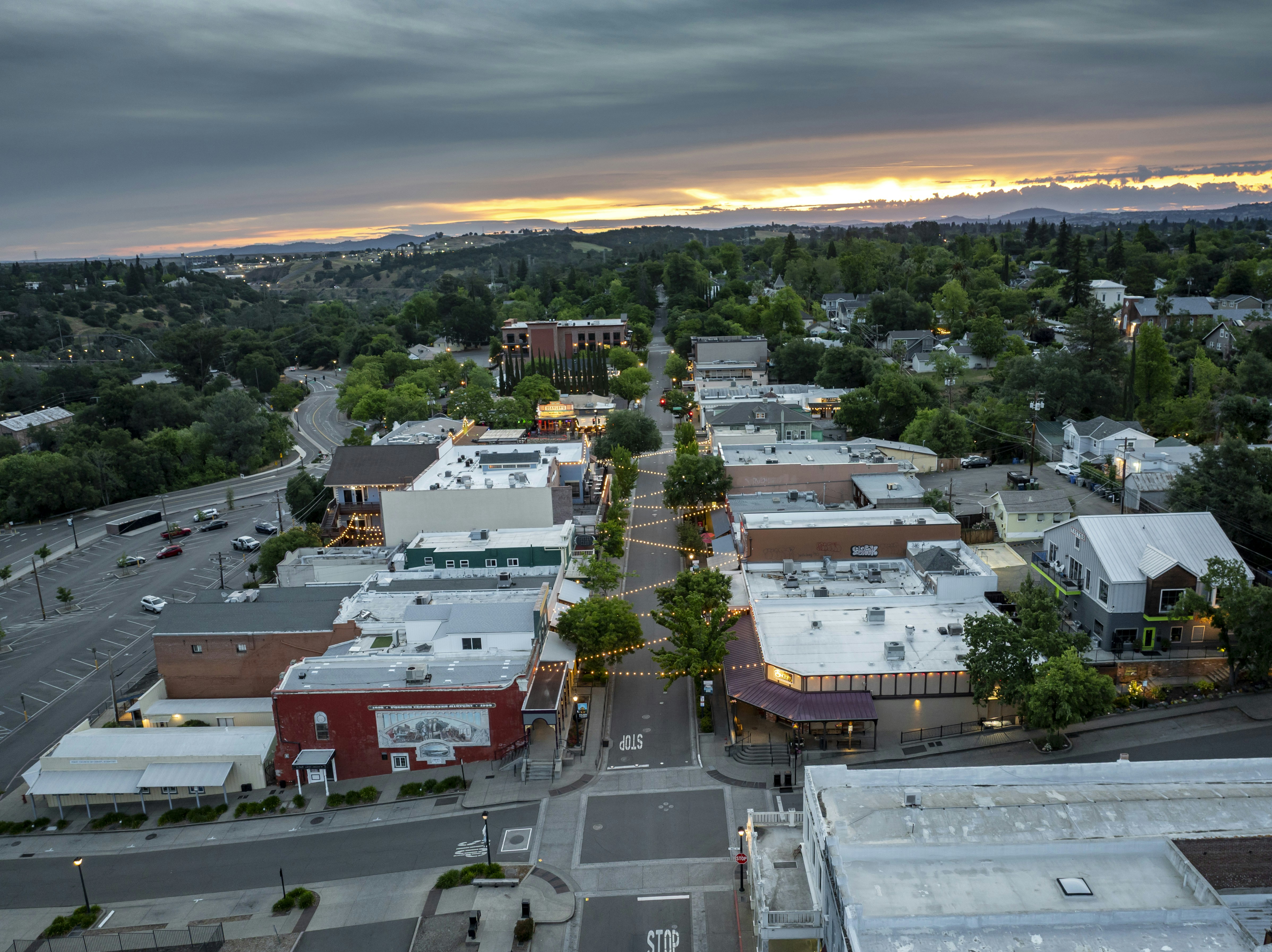 A bird's-eye view of a town at dusk.