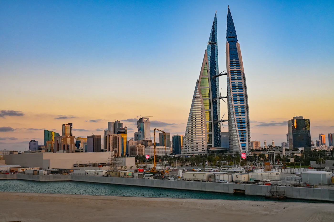 The Bahrain World Trade Center and Manama skyline at sunset