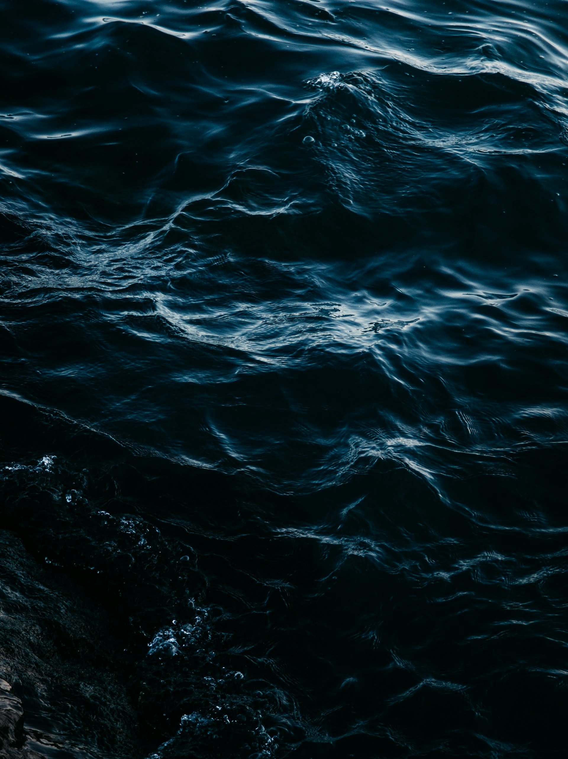 Dark ocean waves create a captivating view.