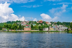 A scenic lake view with houses on the hillside.