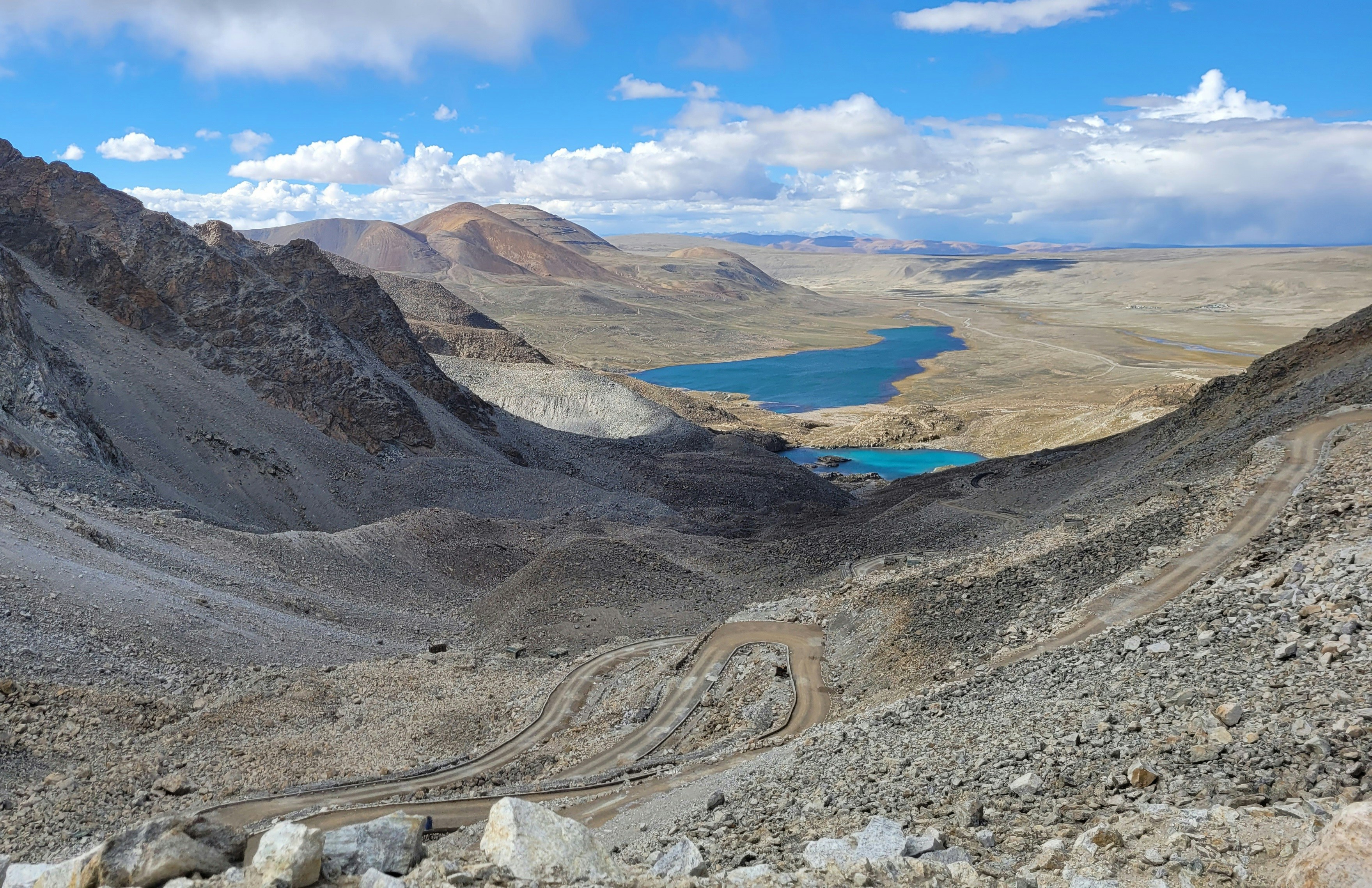 Rocky terrain and blue lakes dominate the landscape.
