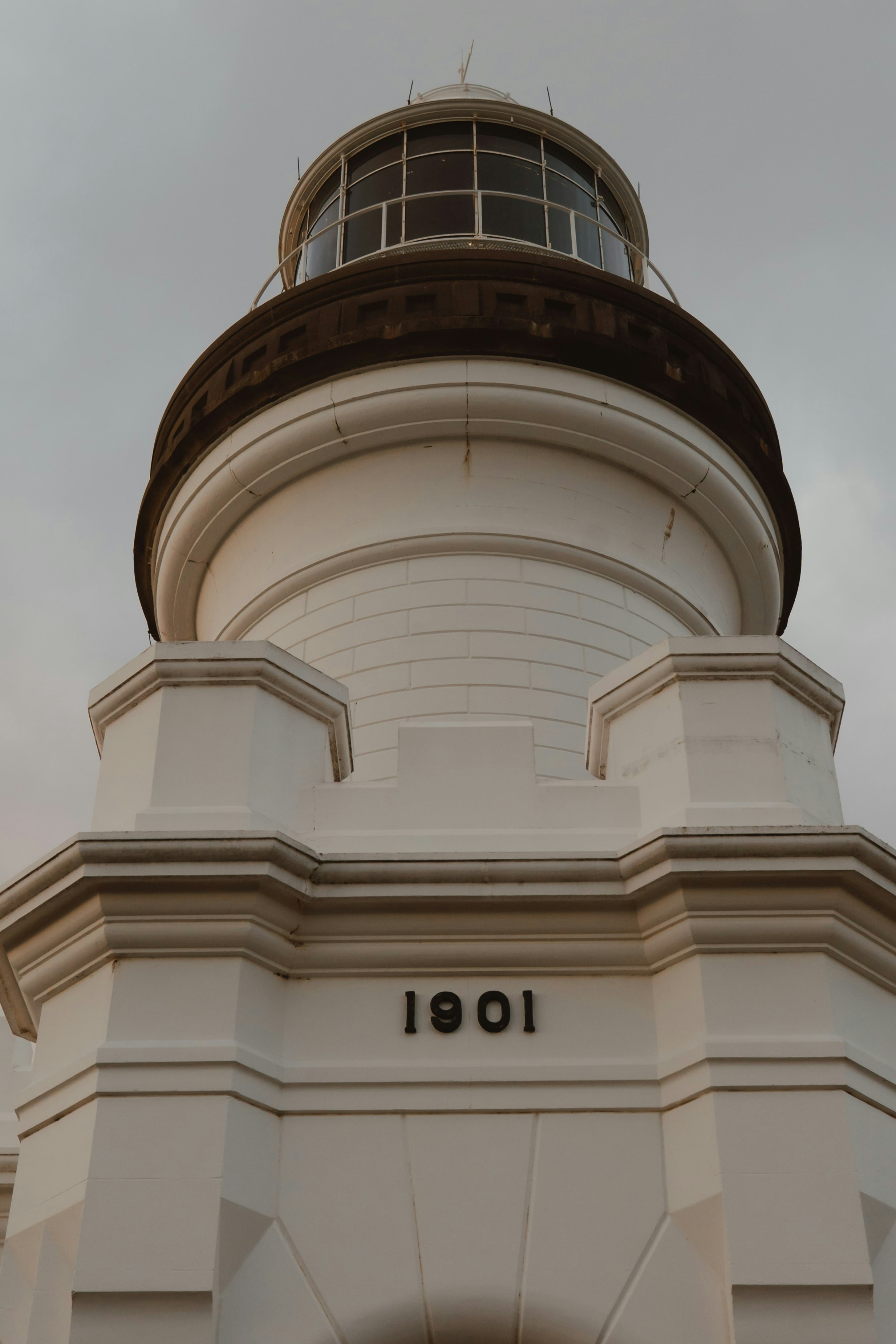 A lighthouse is seen from a low angle.