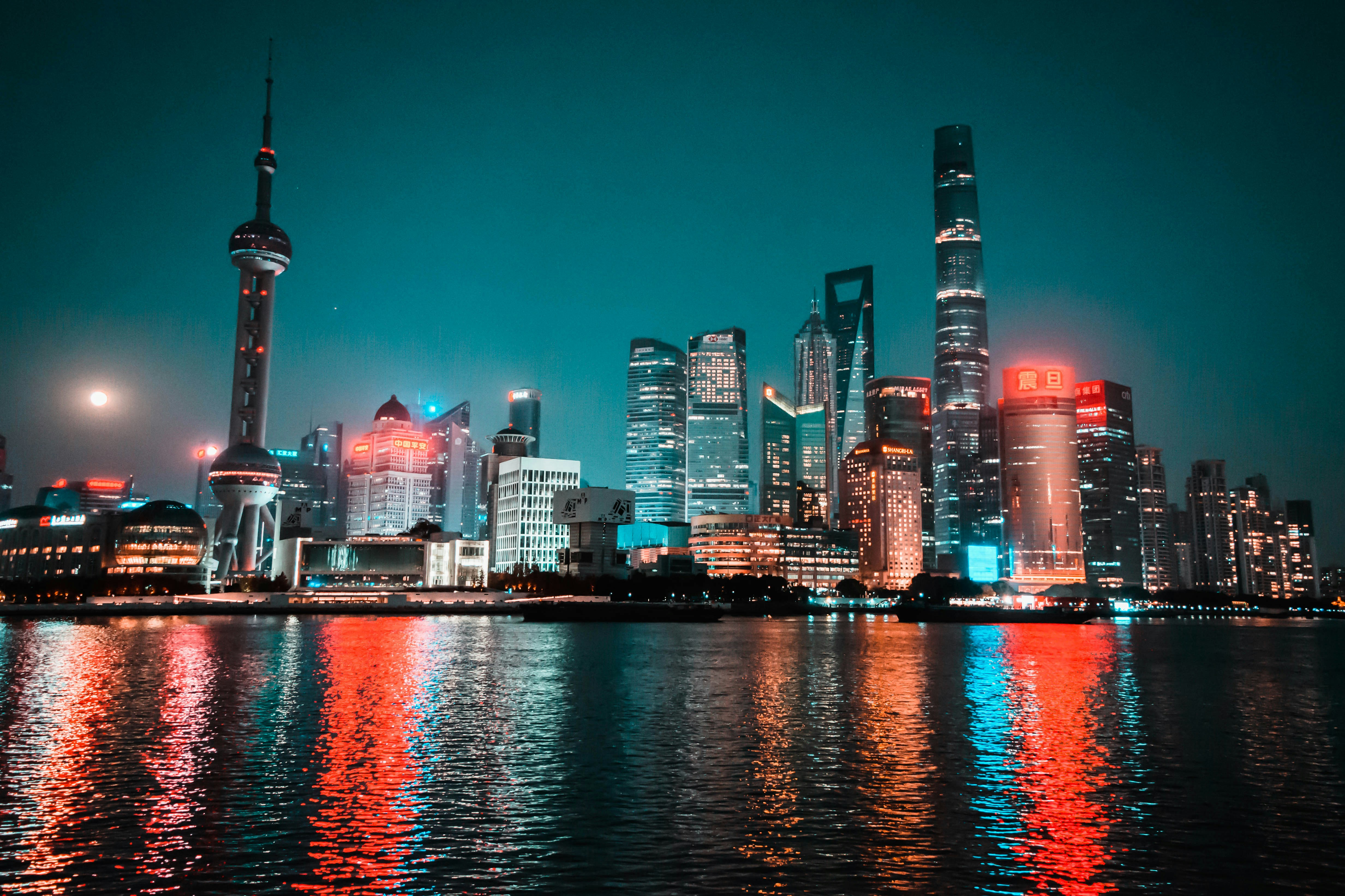 Nighttime skyline reflecting on the water.