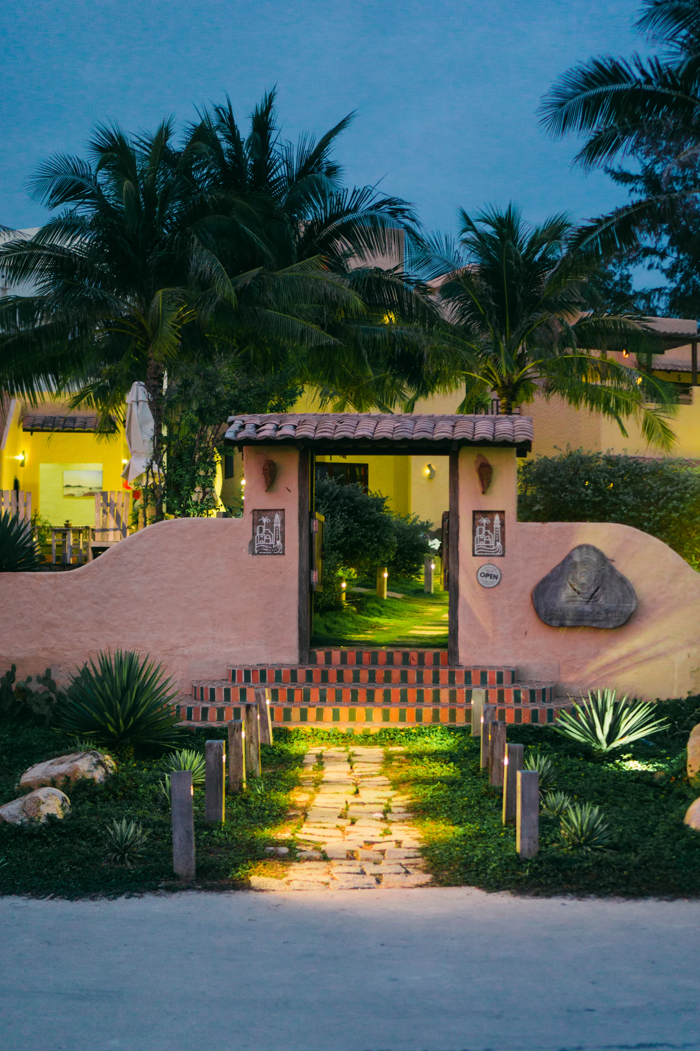 Garden path with low voltage landscape lighting at dusk
