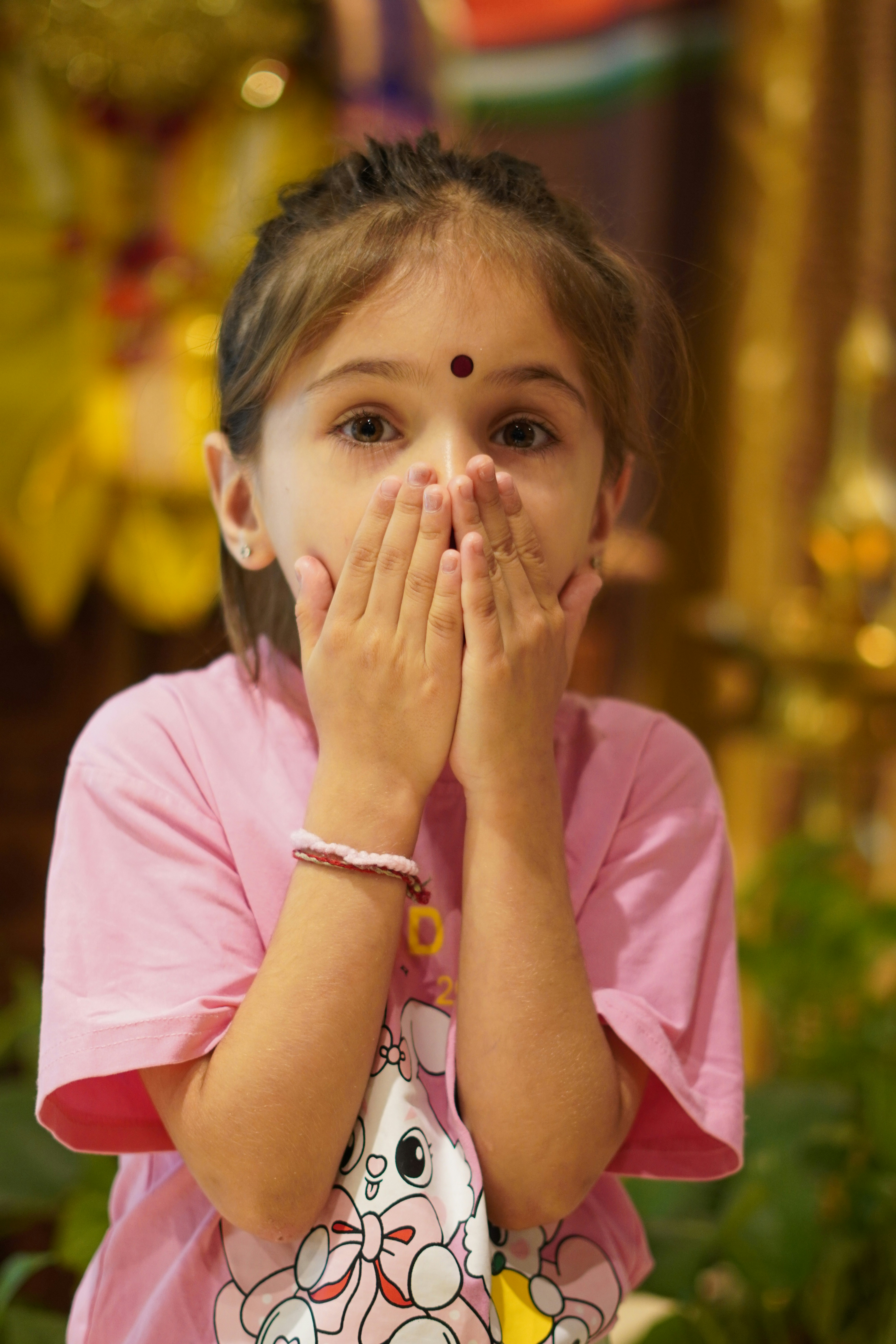 Close up of a child holding a sensory toy in church