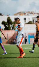 Soccer players are on the field after a game.