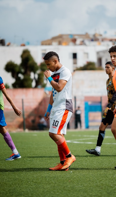 Soccer players competing on the field during a college match