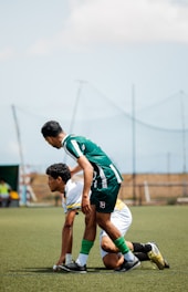 Soccer players prepare to start the game.