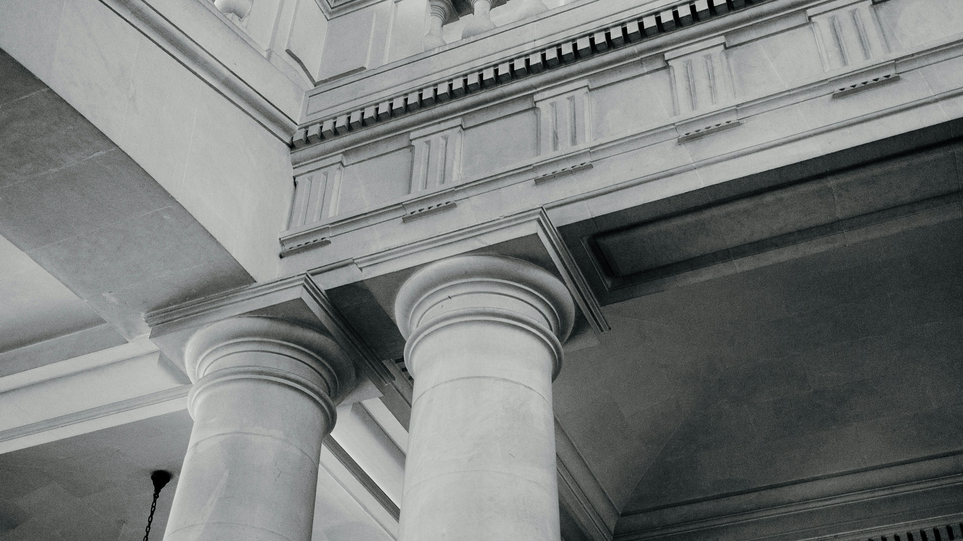 Architectural columns and molding are visible.