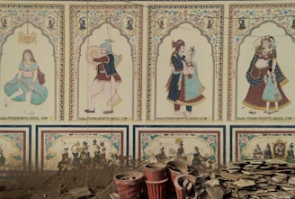 Indian wall paintings depict various figures.