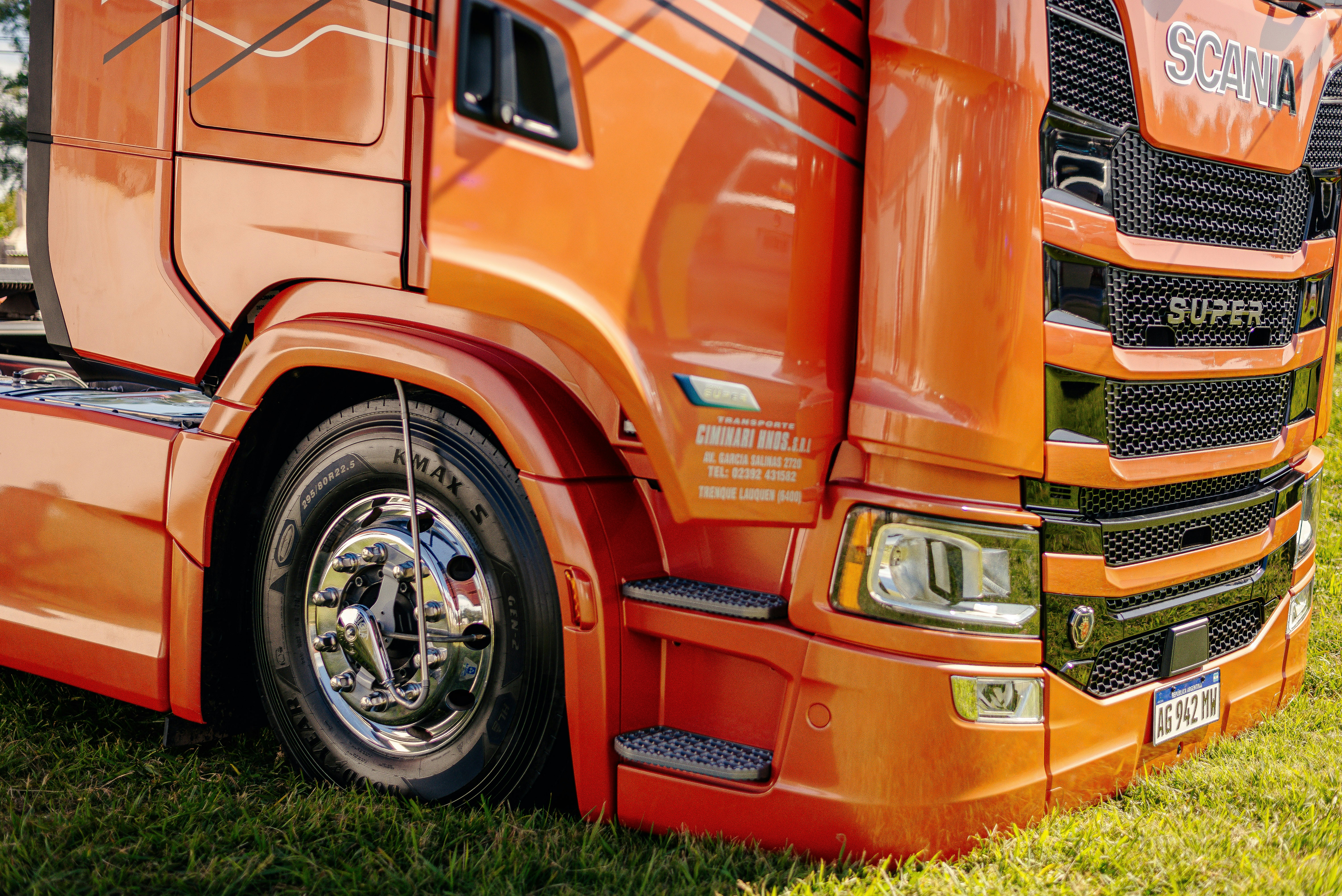 A close-up view of an orange semi-truck.