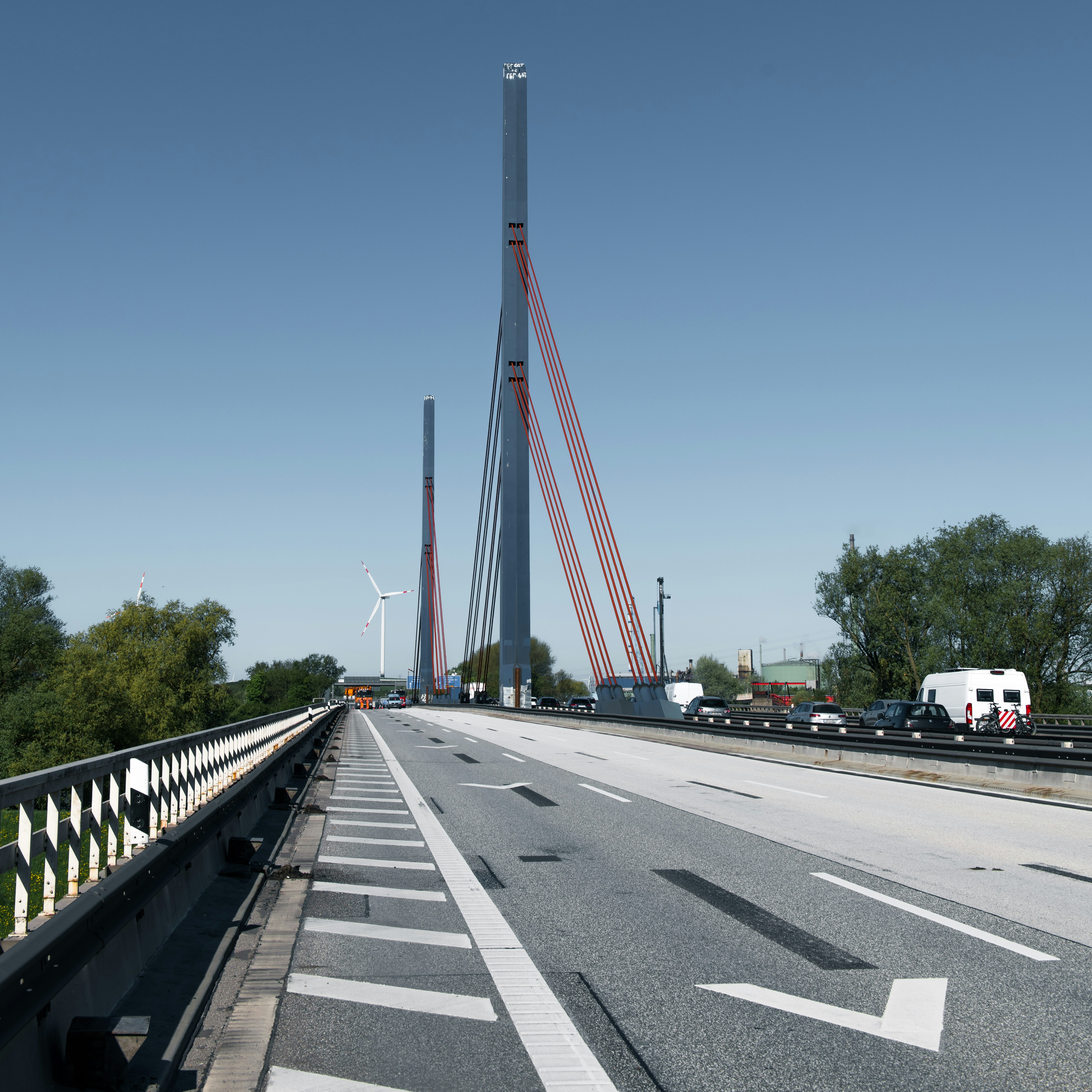 A tall bridge with cables and road.