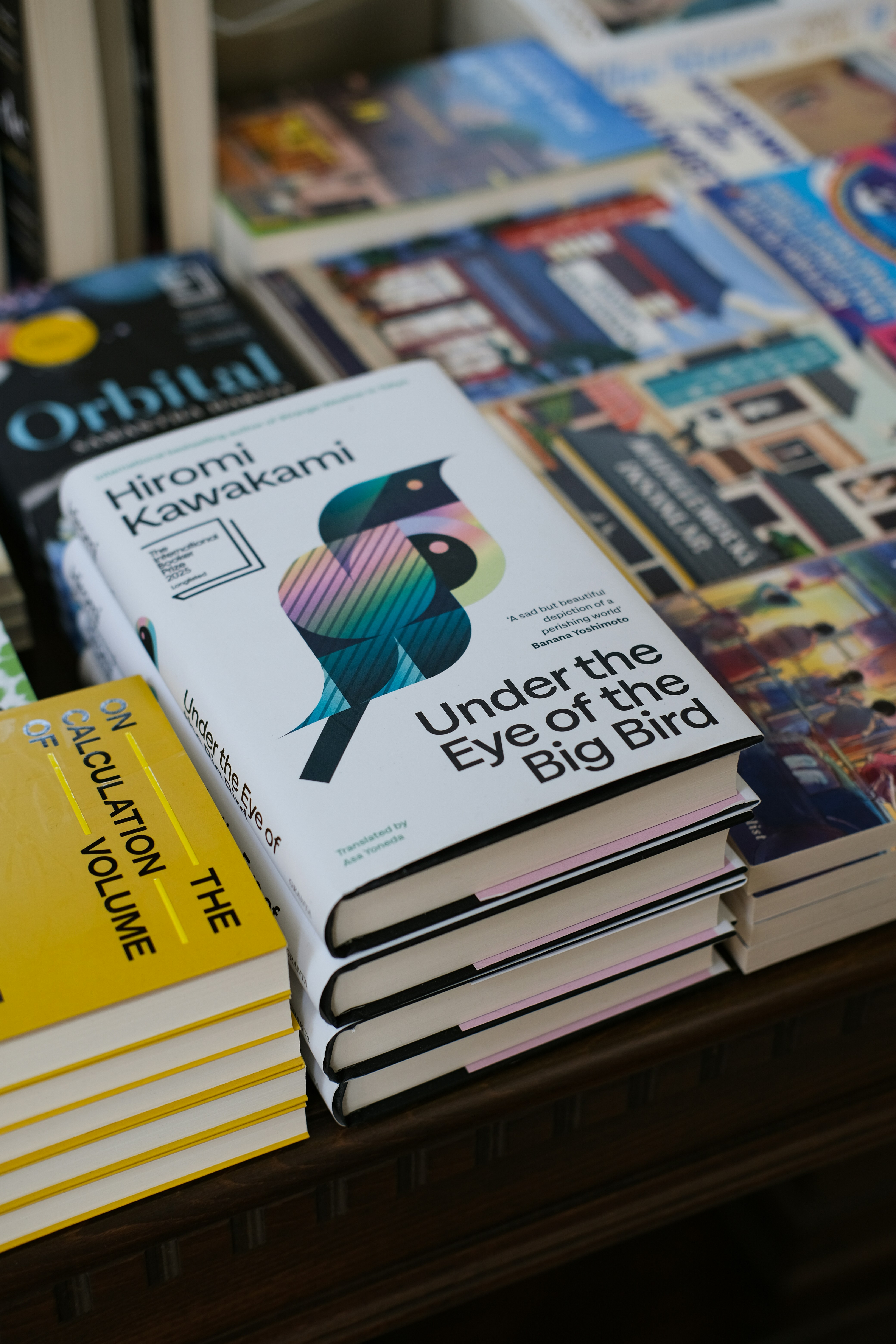 Books are stacked on a display.