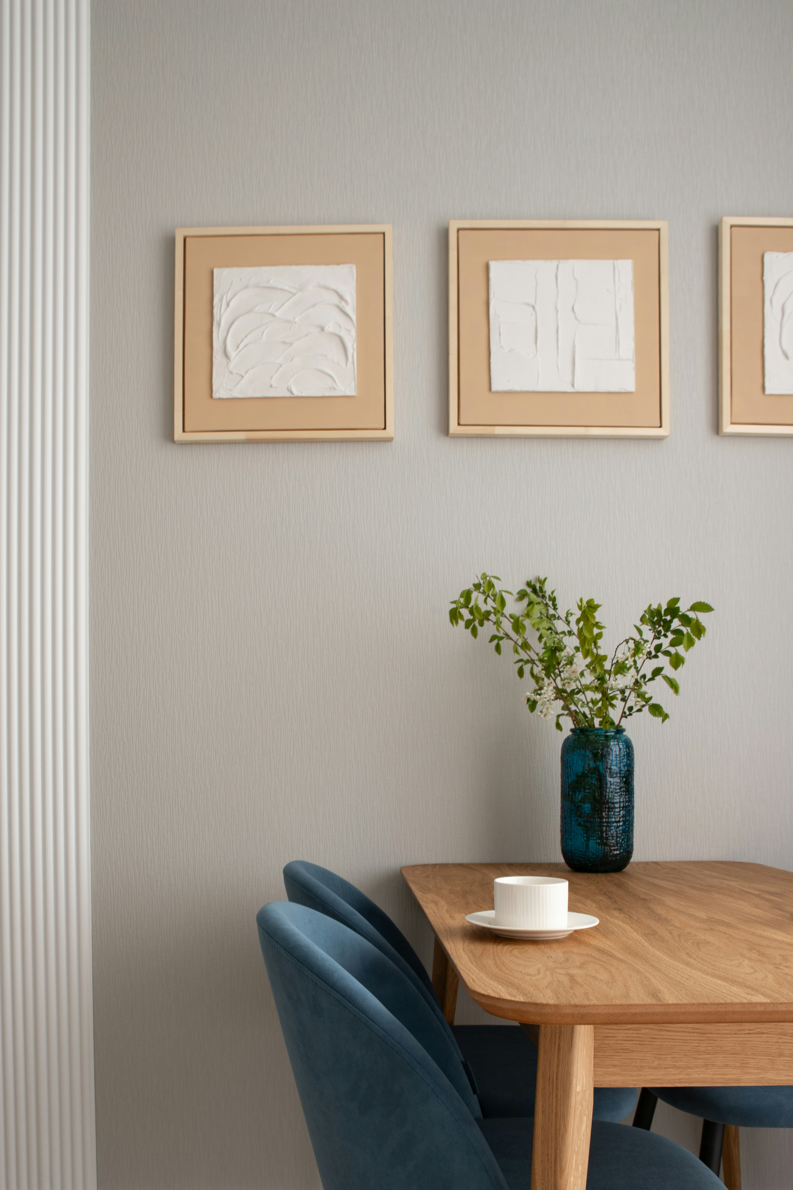 A dining area decorated with minimalist art.