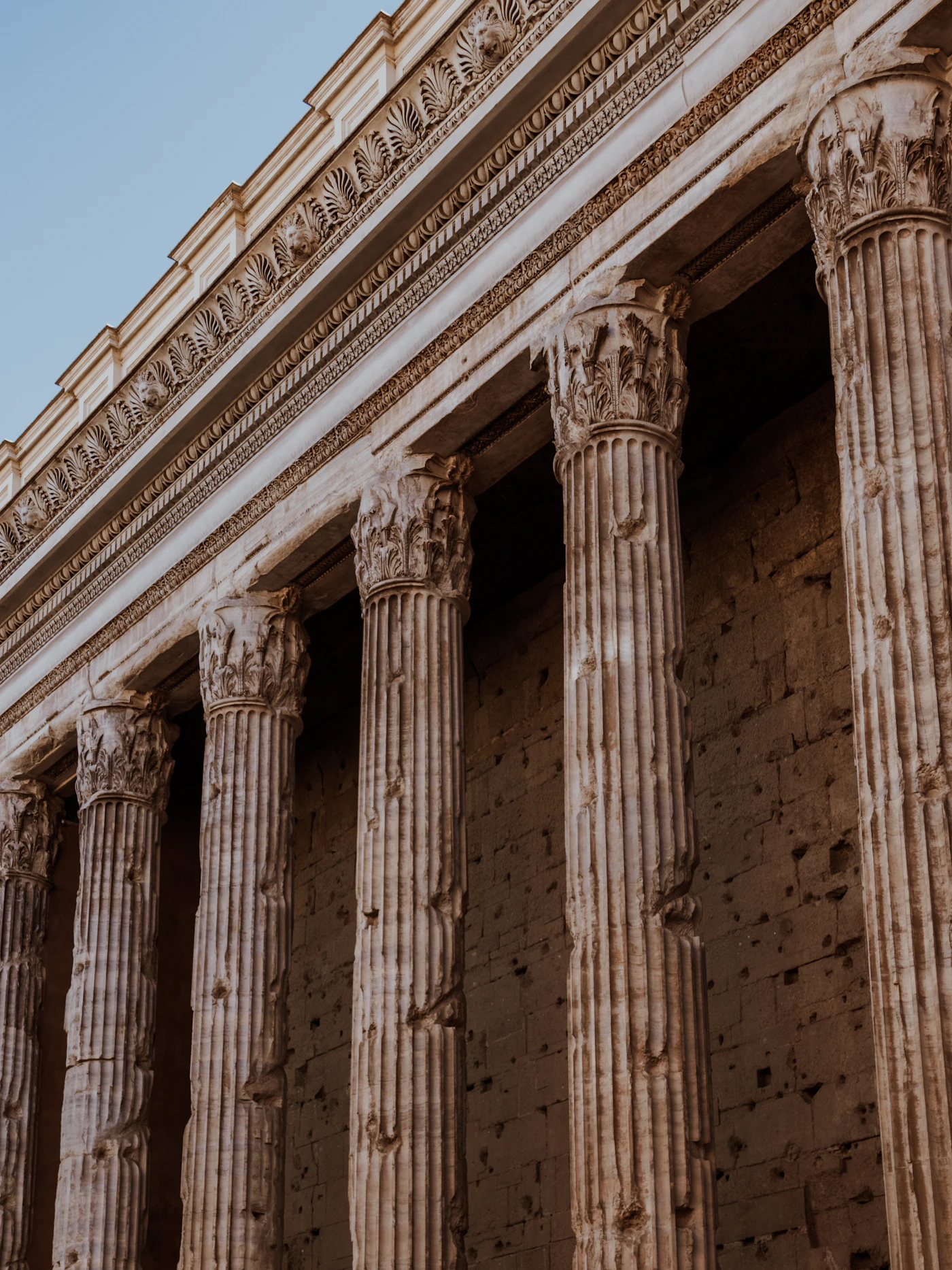Ancient temple columns standing tall against a clear sky