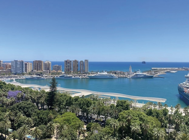 A coastal city with a harbor and ships.