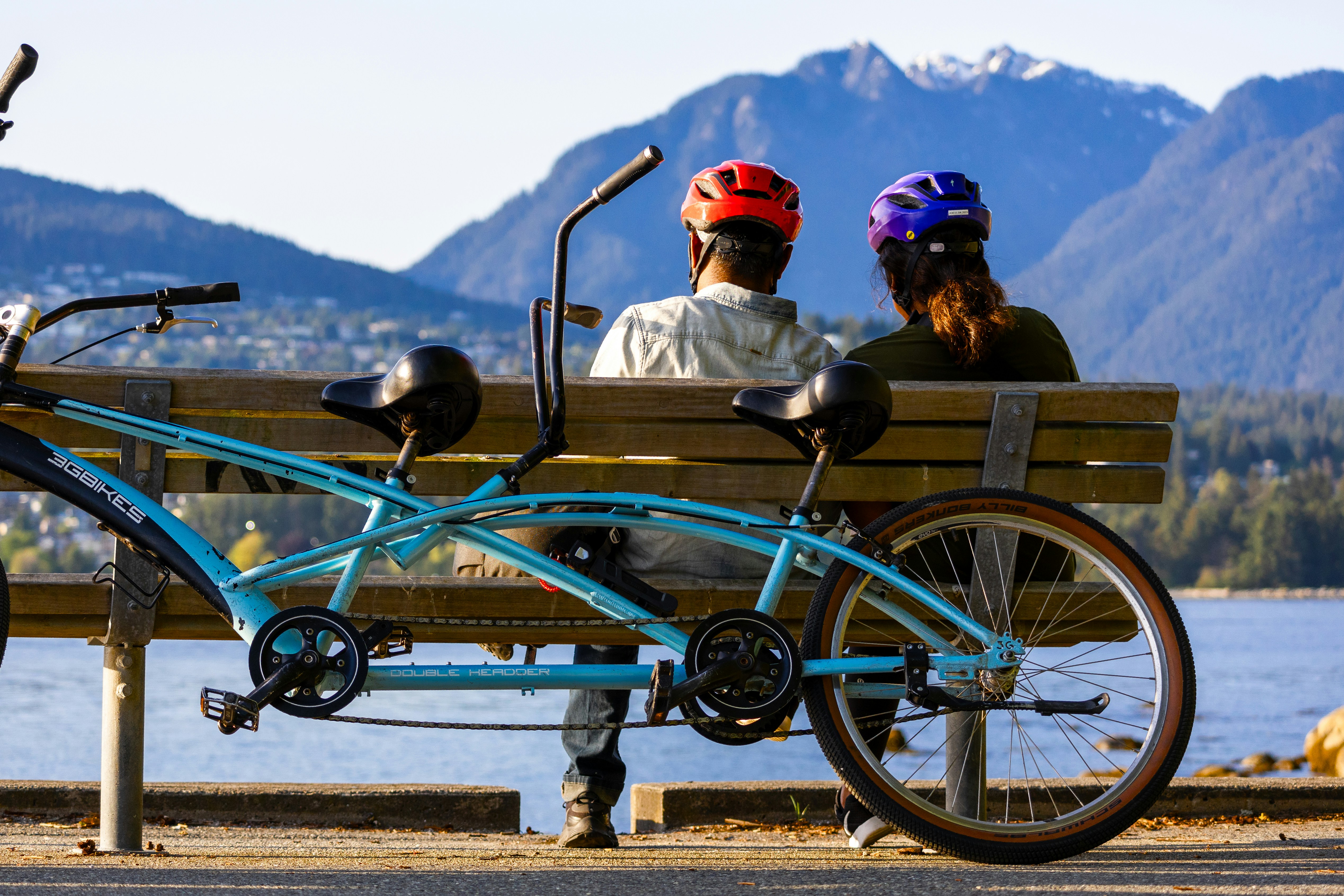 Couple enjoys a view with their tandem bicycle.