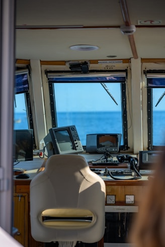 The boat's cabin offers a view of the ocean.