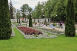 A beautiful park with lush greenery and flowers.