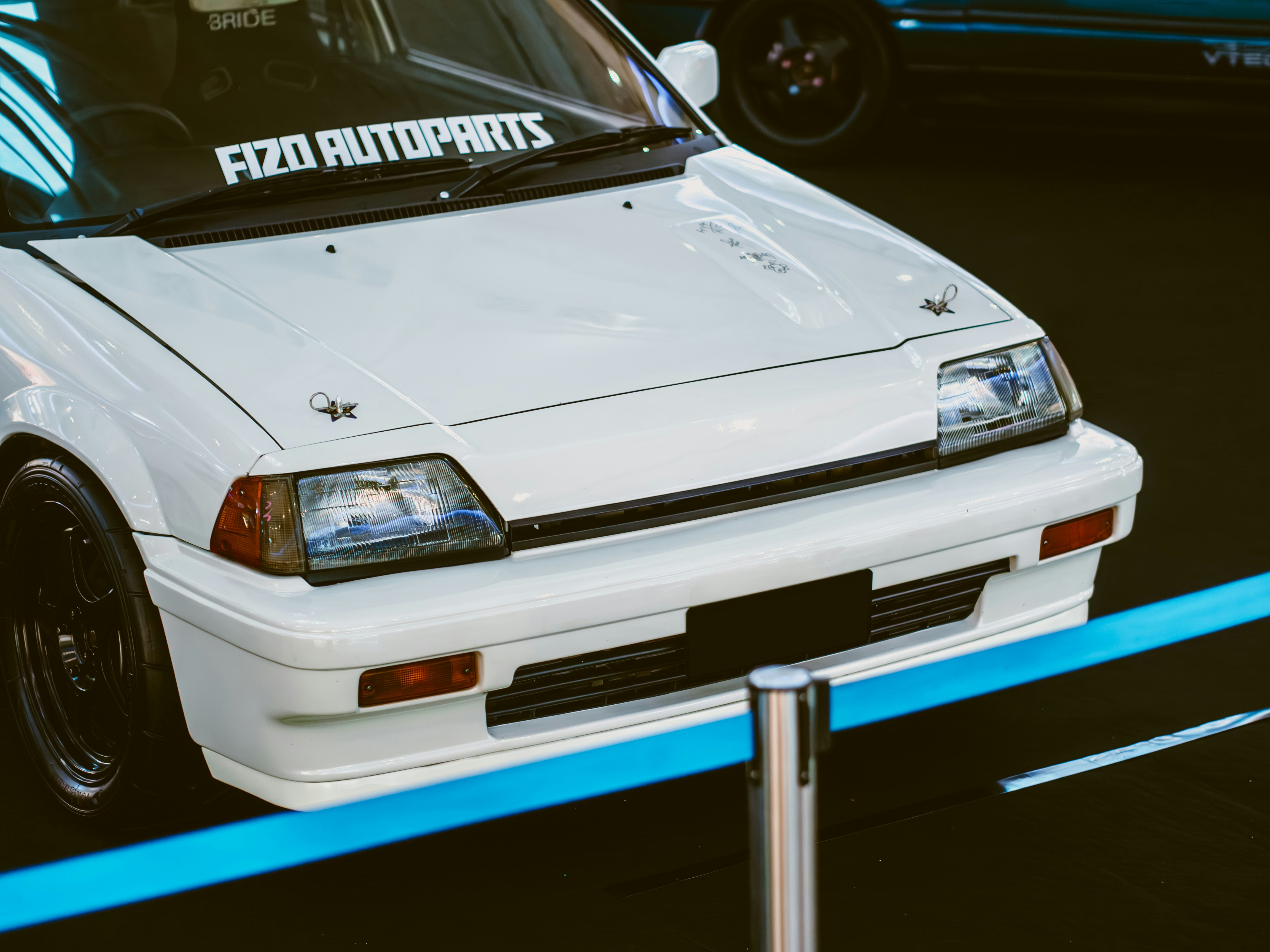 White honda civic, modified and displayed.