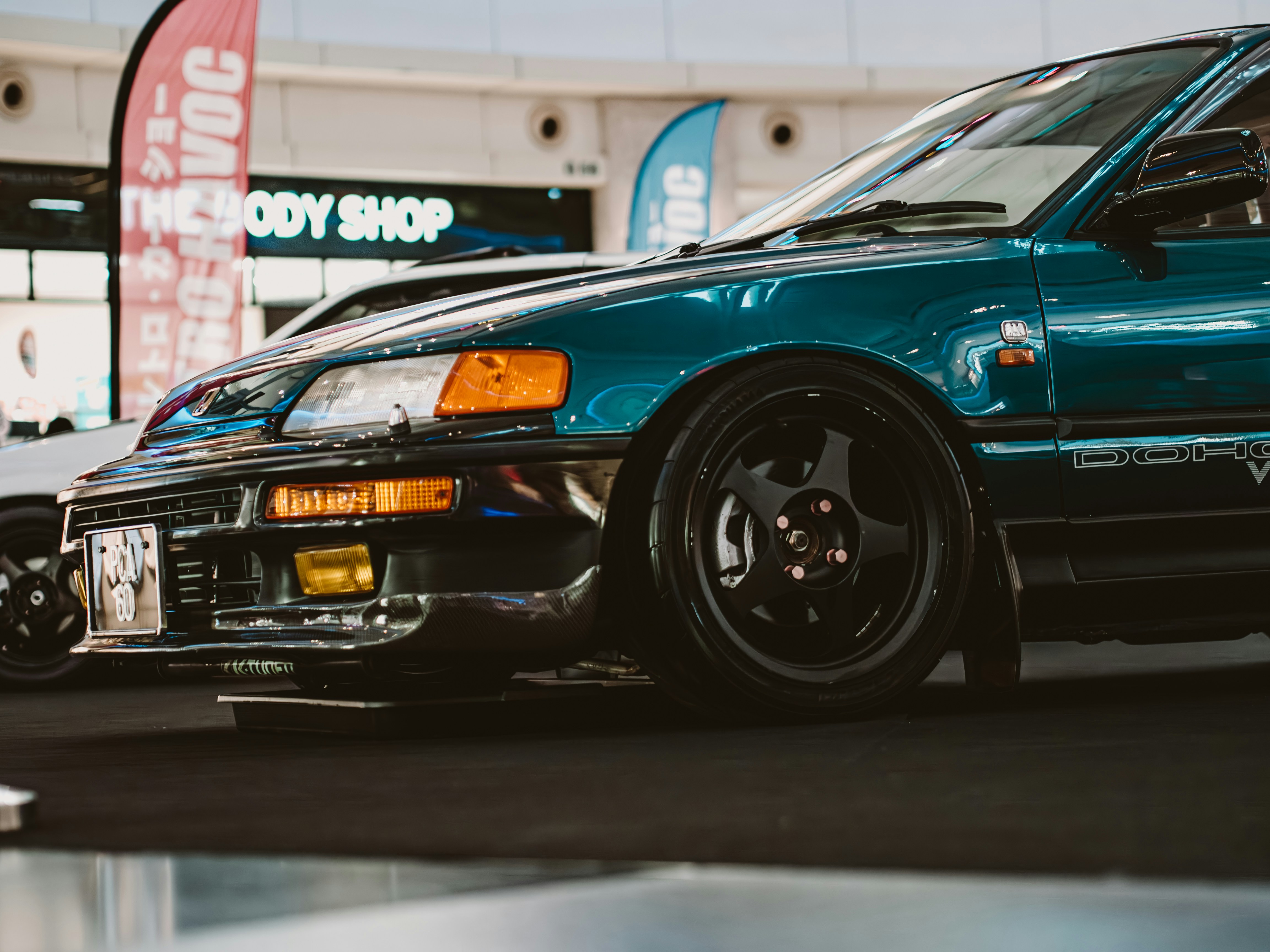 A modified vintage car is showcased.