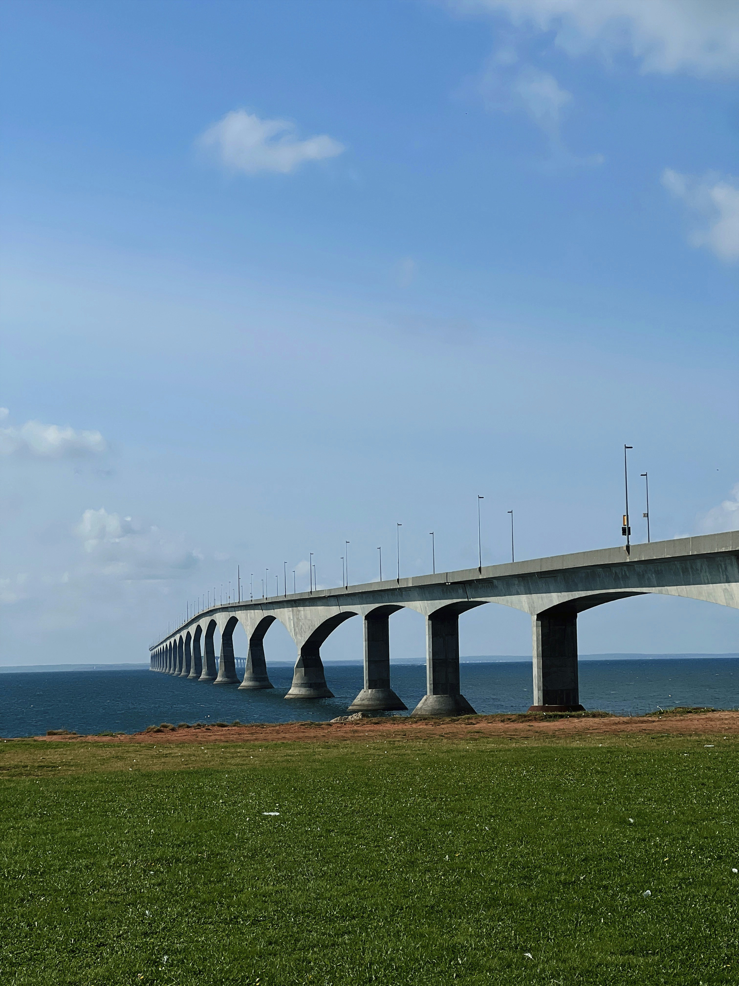 A long bridge stretches across the water.