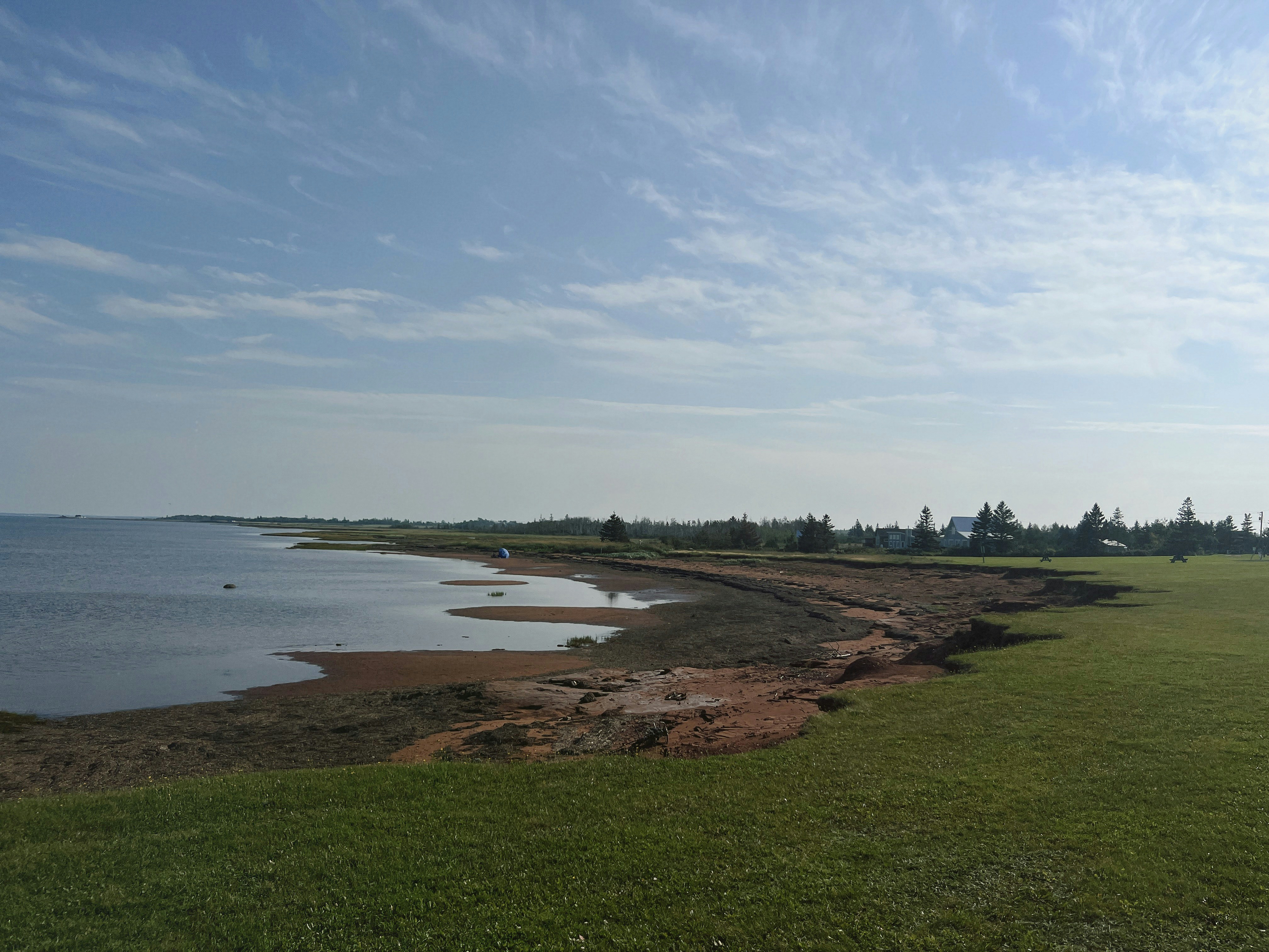 A coastal landscape with water and land.