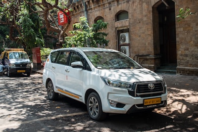 A white car parked on a city street.