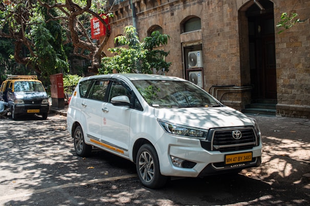 A white car parked on a city street.