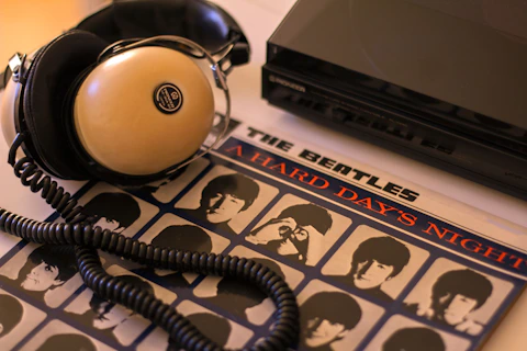 Headphones and a beatles album ready for listening.