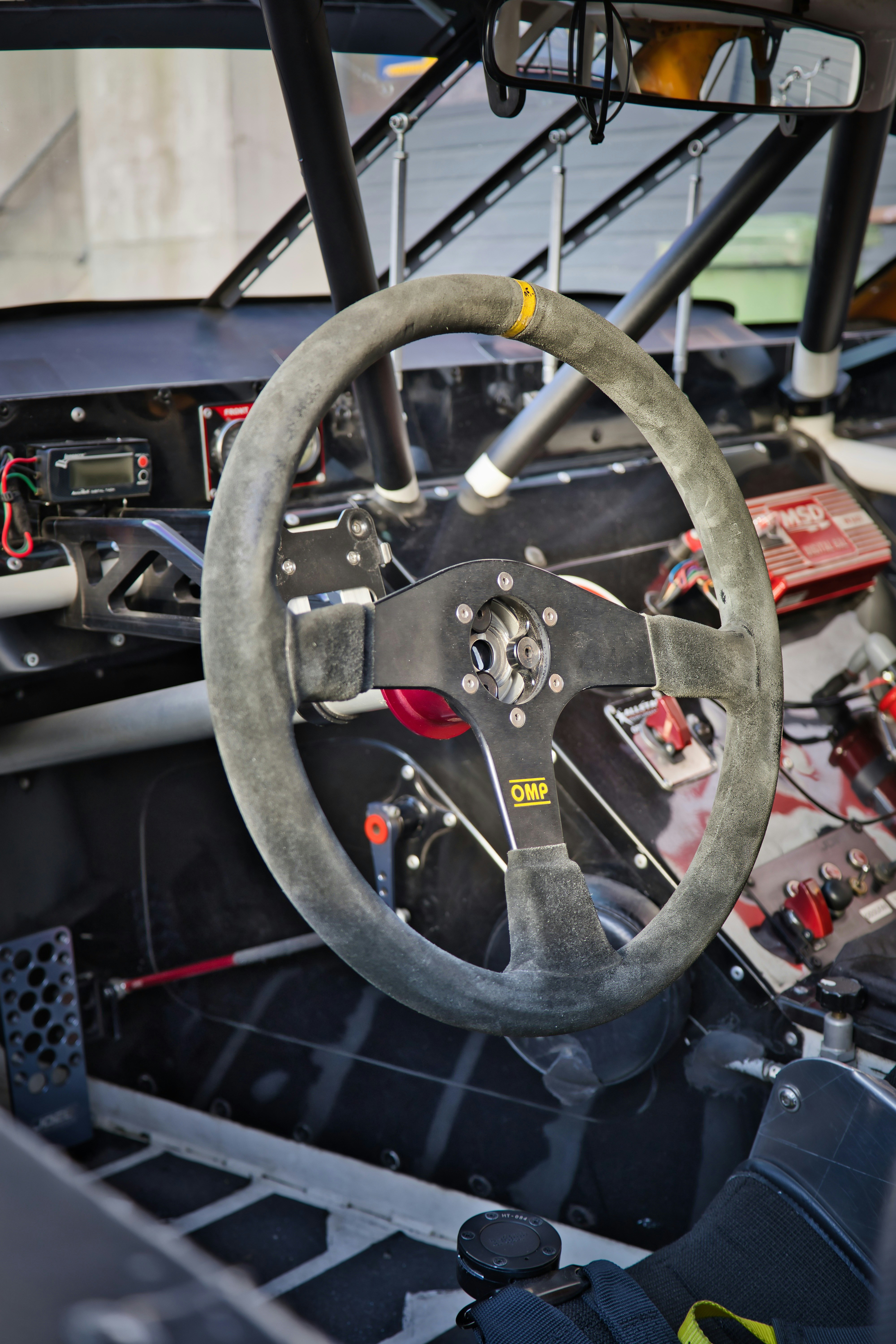A racing car's steering wheel and cockpit.