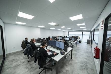 Office workers are busy working on computers.