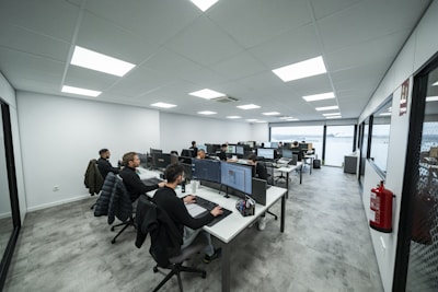 Office workers are busy working on computers.