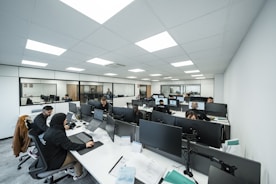 Office workers are busy working on computers.