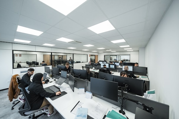 Office workers are busy working on computers.