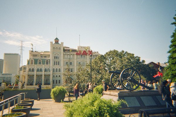 Cannon sits in front of a large building — New Orleans, United States