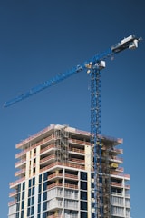 Construction of a tall building with a crane.