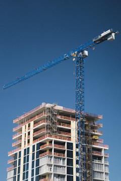 Construction of a tall building with a crane.