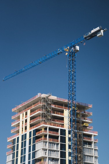 Construction of a tall building with a crane.