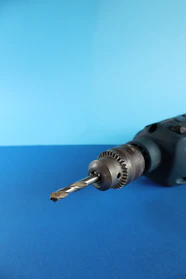 A drill with a drill bit.