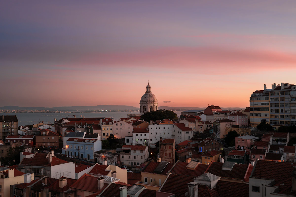 Lisbon's terracotta rooftops and the Tagus under autumn light