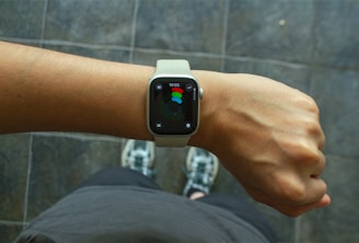 A wrist with an apple watch.